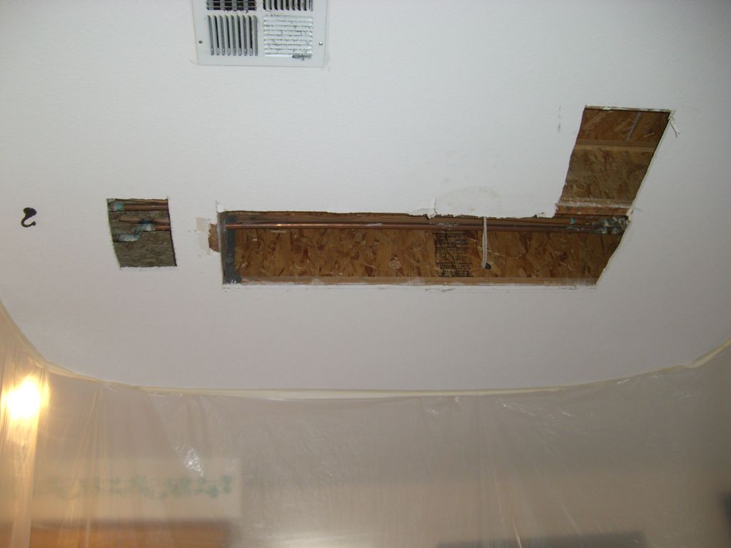 L-shaped ceiling opening before drywall repair