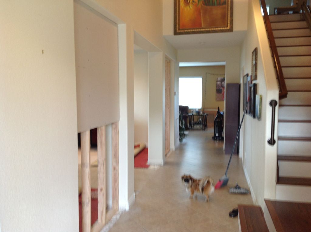 open hallway drywall before