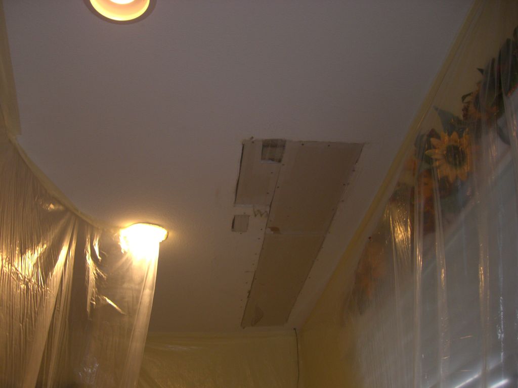 Patterned ceiling area before drywall patching