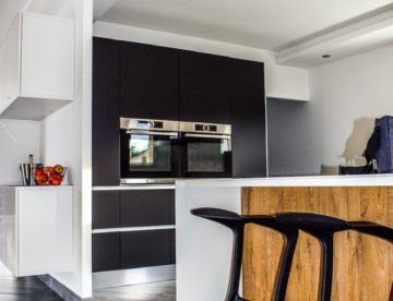 two black wooden bar stools