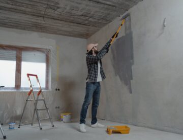 man painting the wall