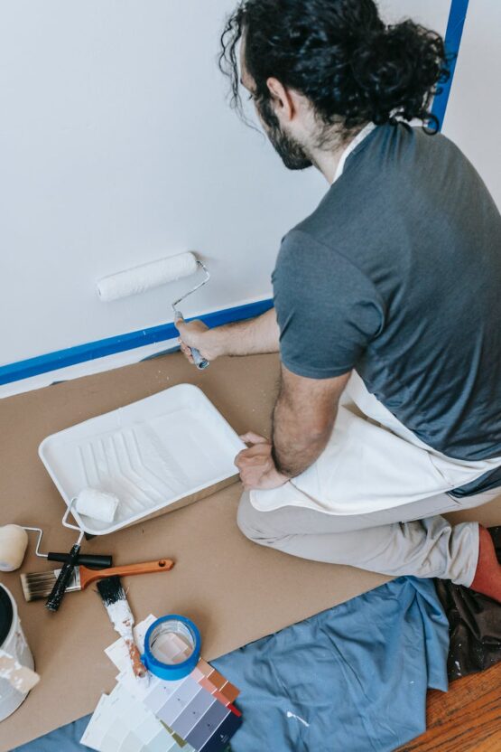 a man painting the wall