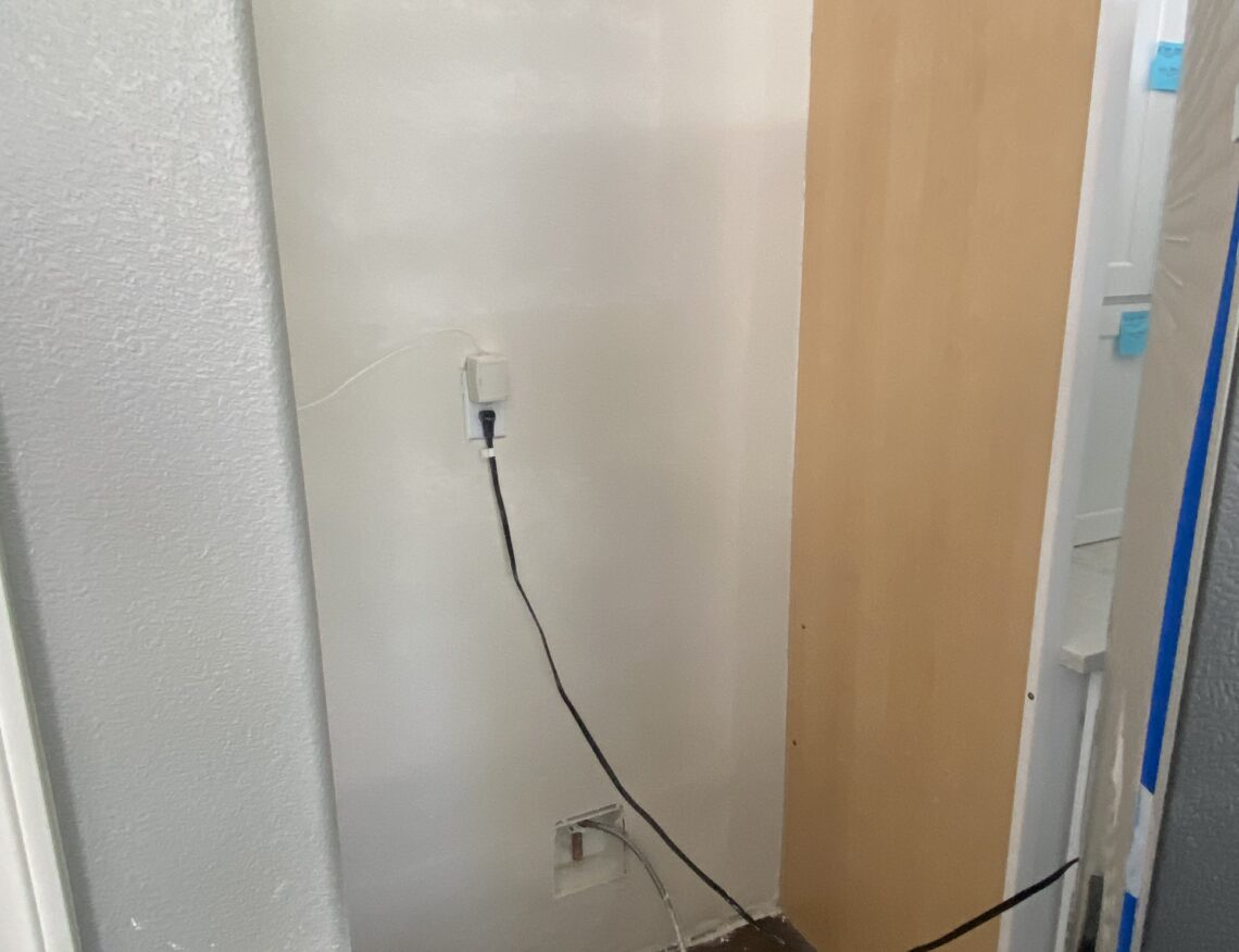 Water damage repair behind fridge after