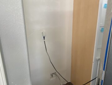 Water damage repair behind fridge after