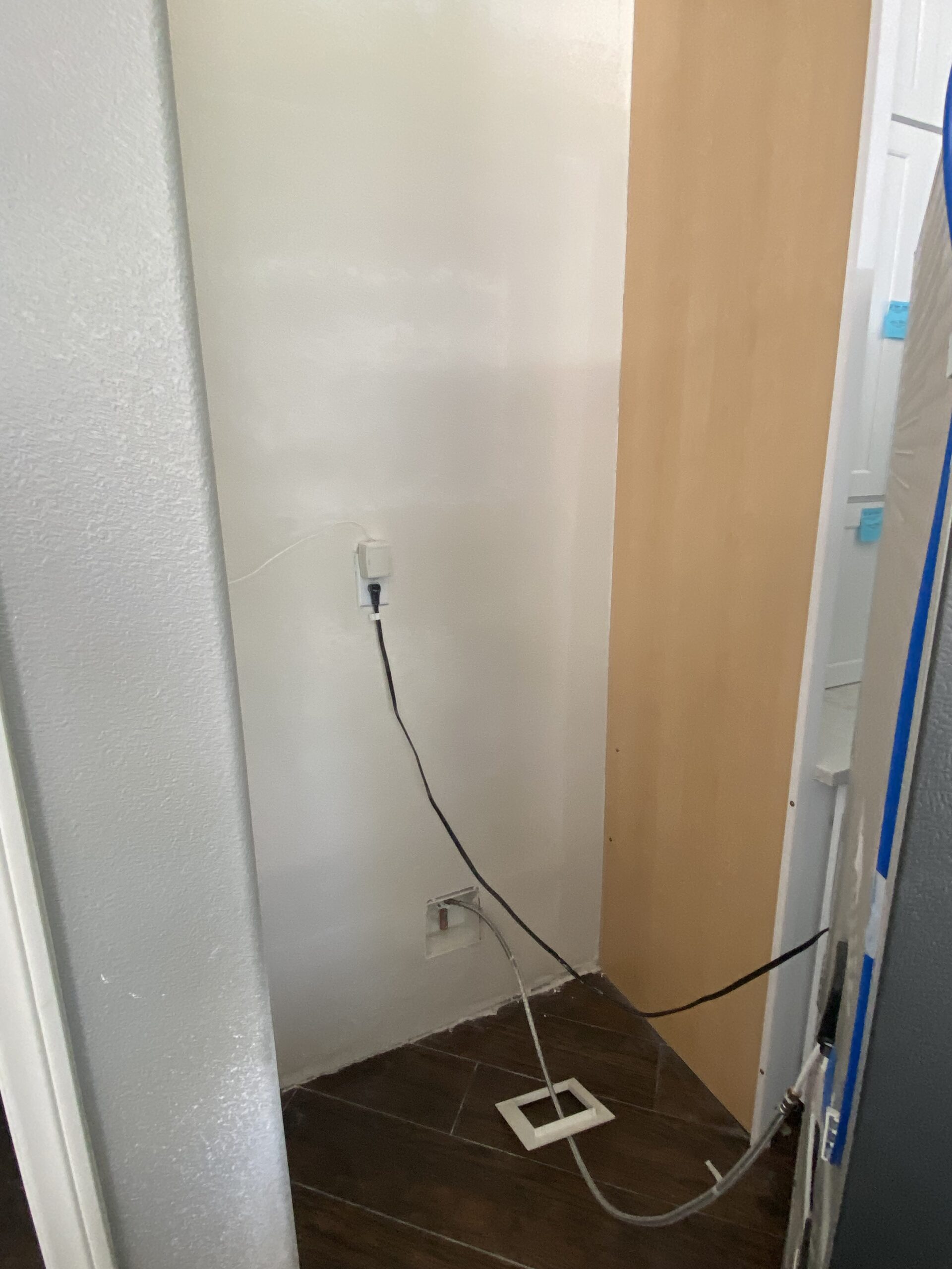 Water damage repair behind fridge after