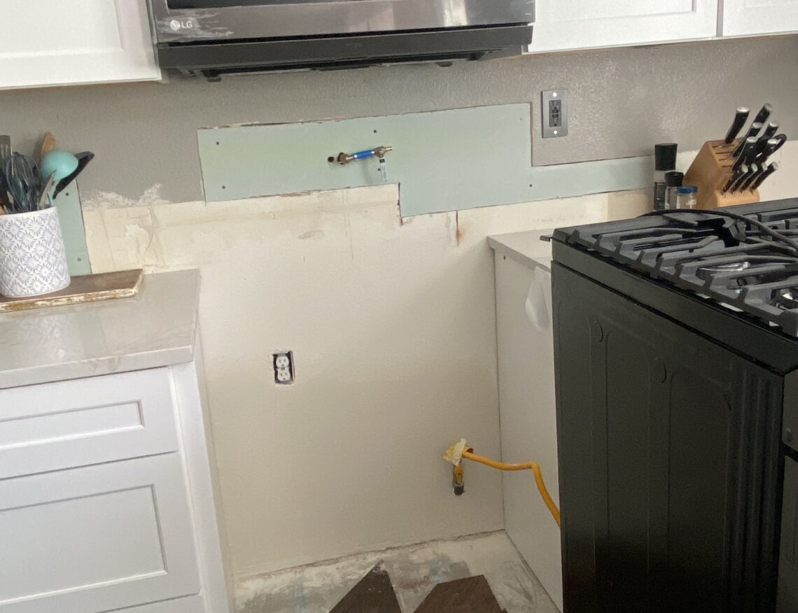 Drywall repair behind stove after