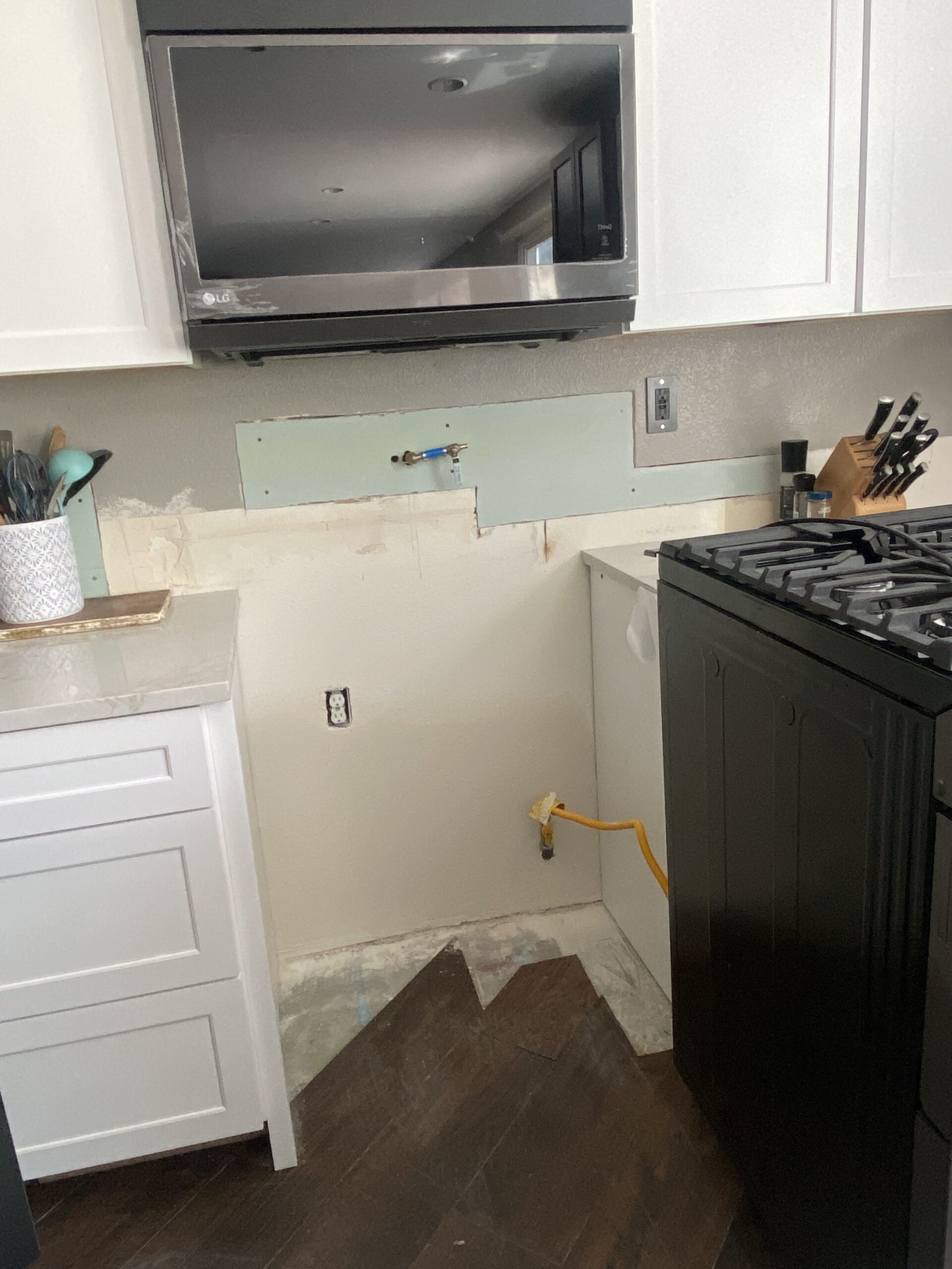 Drywall repair behind stove after