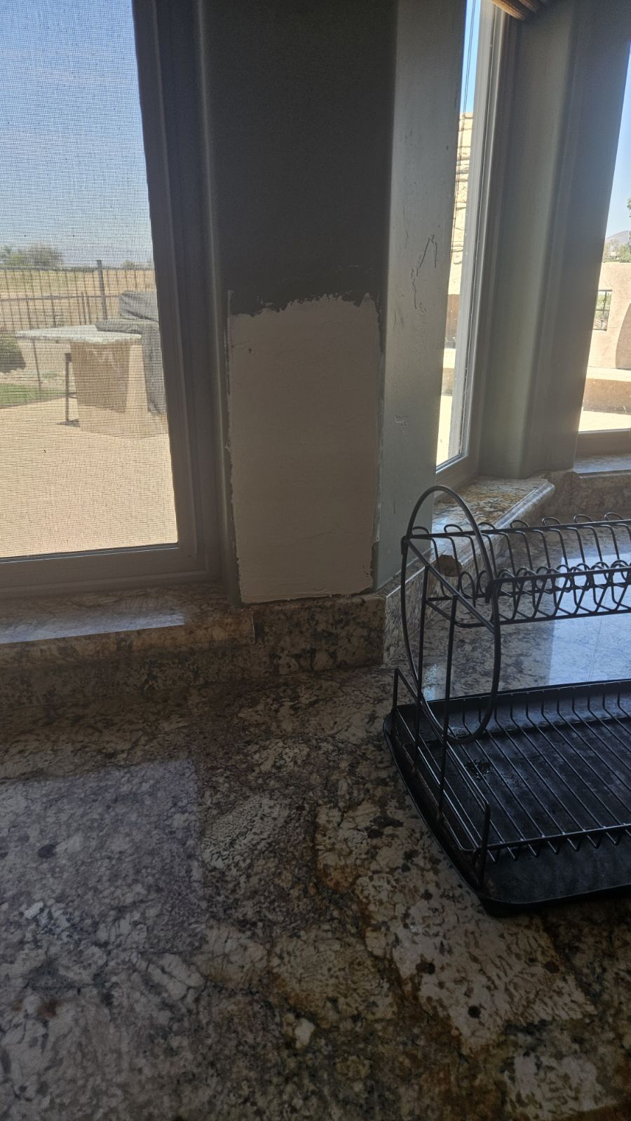 Before smooth drywall texture repair in kitchen