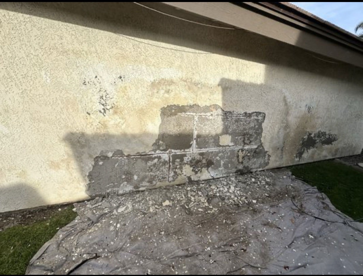 Exterior stucco repair before