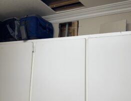 Drywall repairs in laundry room before