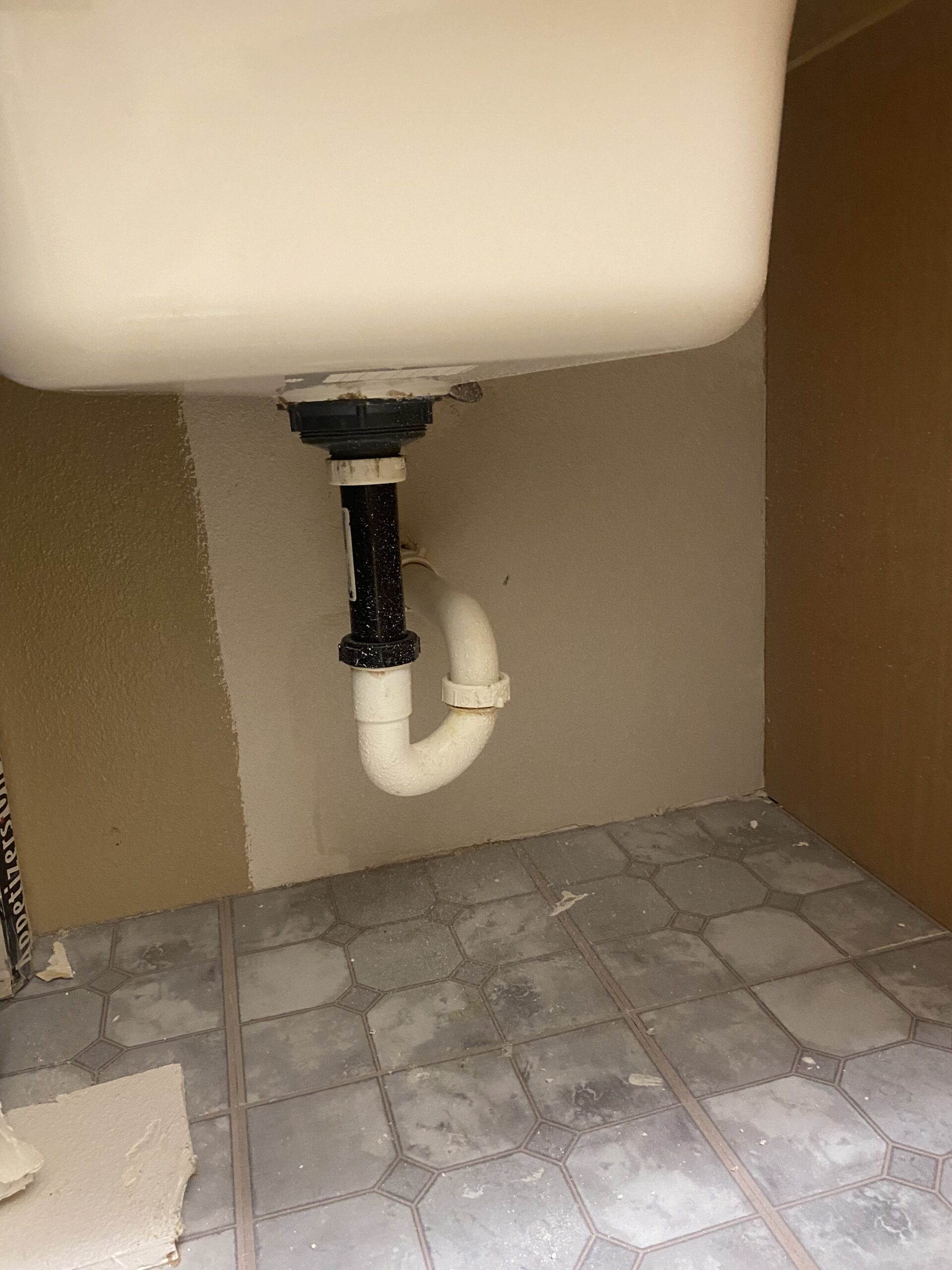 Drywall repair under the sink after